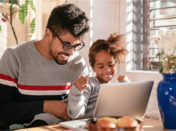 father and daughter studying